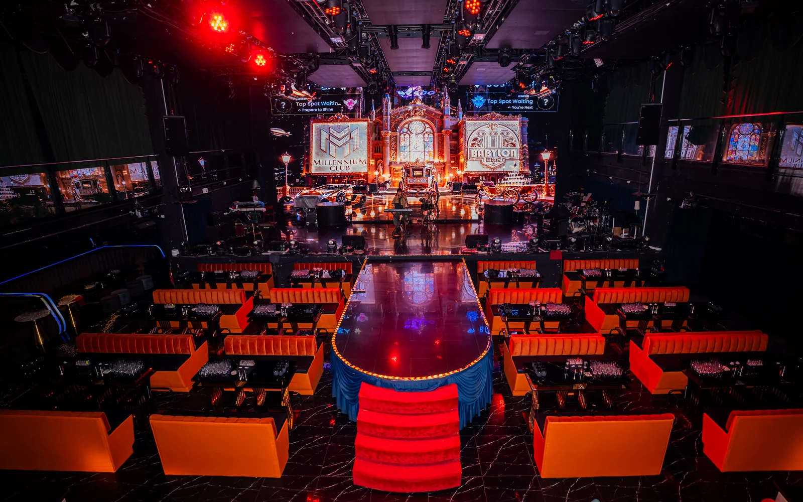 Main floor, central runway and red sofa seating at Millennium Club KL, Bukit Bintang