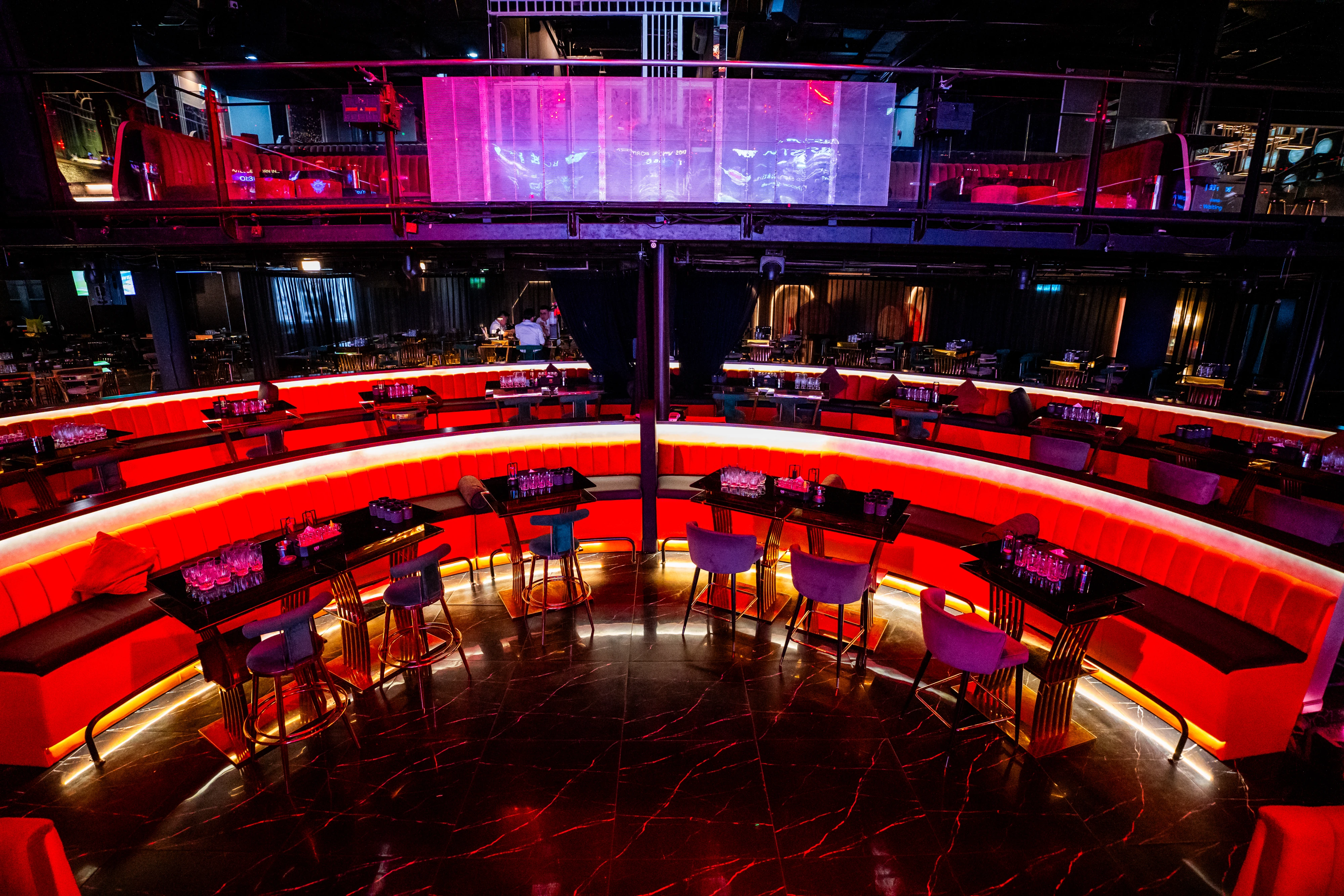 Red sofas surrounding the runway and live stage at Millennium Club KL, Bukit Bintang