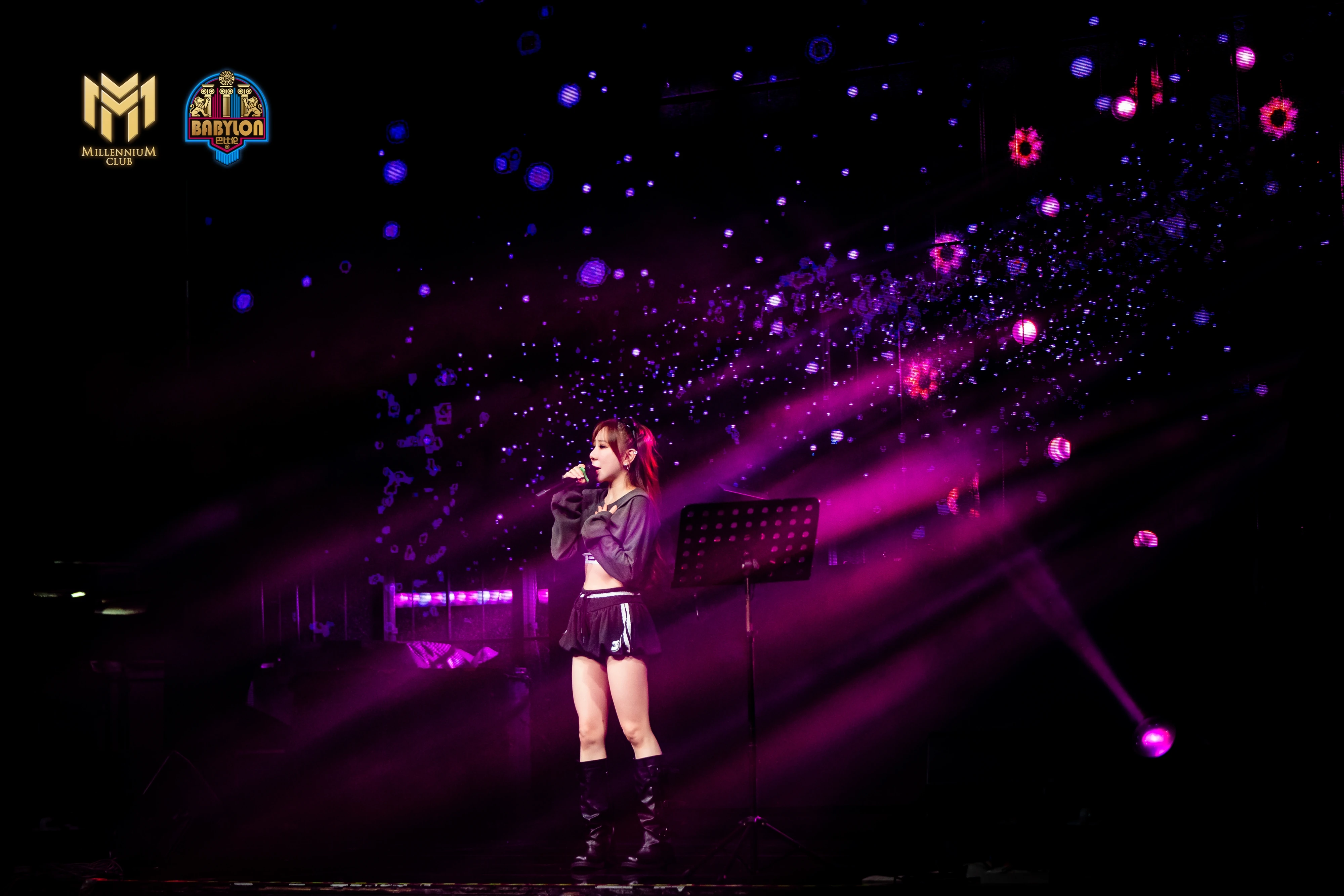Solo singer surrounded by magenta light beams at Millennium Club KL, Bukit Bintang
