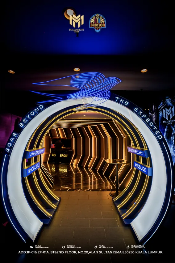 Gold circular entrance portal lit in blue at Millennium Club KL, Bukit Bintang