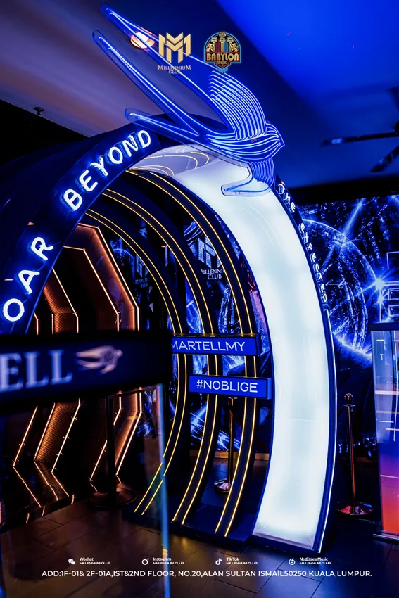 Angled view of the illuminated entrance arch at Millennium Club KL, Bukit Bintang