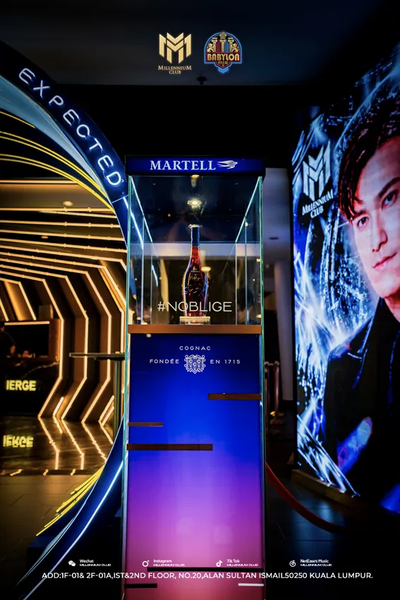 Blue entrance walkway and gold geometric arches at Millennium Club KL, Bukit Bintang