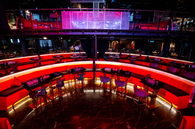 Red sofas surrounding the runway and live stage at Millennium Club KL, Bukit Bintang