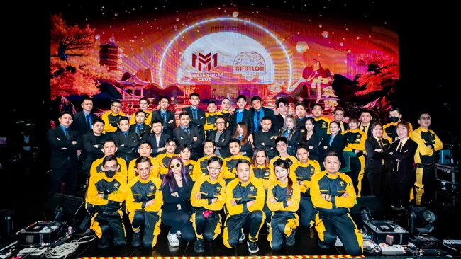 Large group gathered on the stage for a celebration at Millennium Club KL, Bukit Bintang