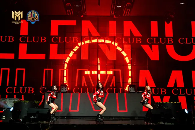 Dance group in front of a red LED stage screen at Millennium Club KL, Bukit Bintang