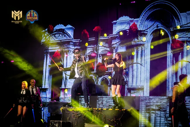 Wide stage performance with yellow beams and an LED backdrop at Millennium Club KL, Bukit Bintang