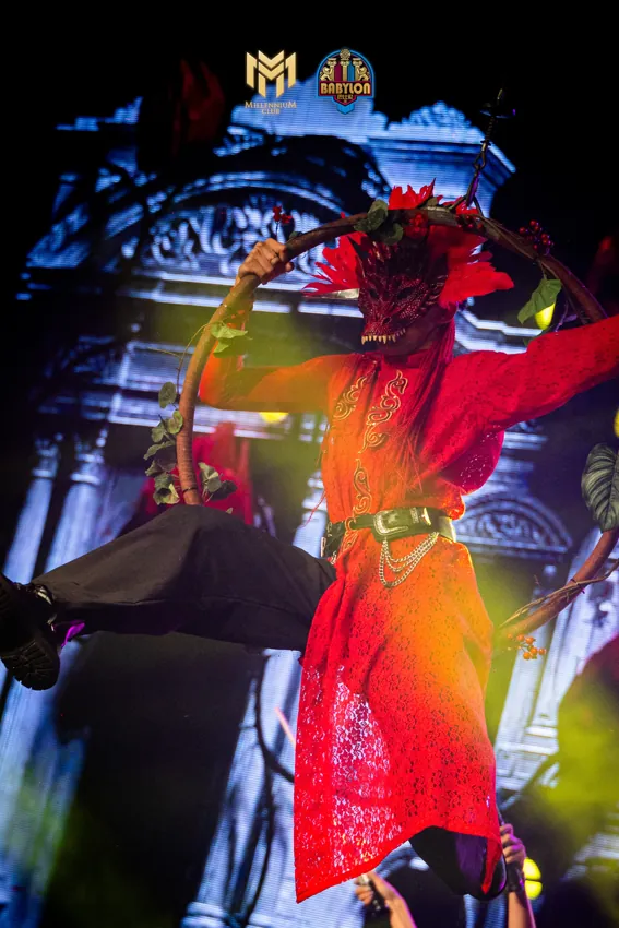Performer in red on an elevated stage platform at Millennium Club KL, Bukit Bintang