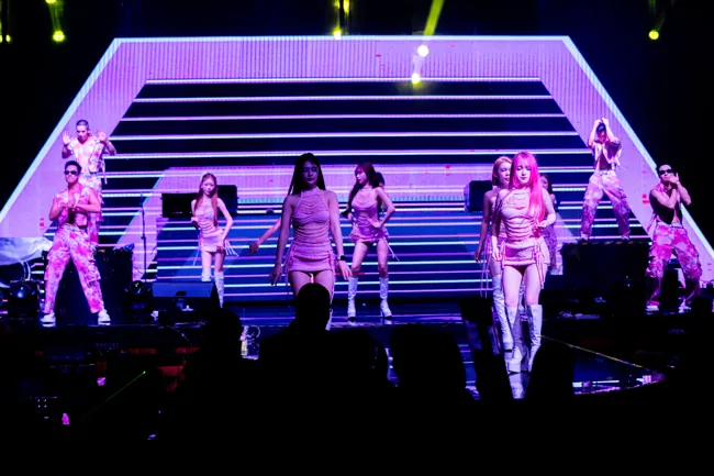 Dance troupe lined up before a purple geometric LED screen at Millennium Club KL, Bukit Bintang